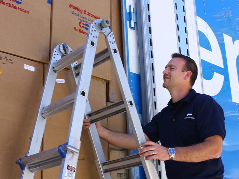 Commercial man unpacking north american truck